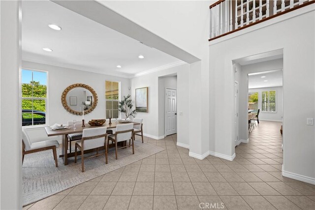 26865 Grey Pl, Stevenson Ranch, CA 91381 - dining space featuring light tile patterned floors, ornamental molding, baseboards, and recessed lighting