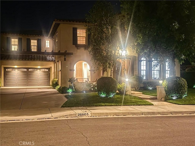 26865 Grey Pl, Stevenson Ranch, CA 91381 - view of front facade featuring stucco siding, a garage, and driveway