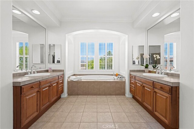 26865 Grey Pl, Stevenson Ranch, CA 91381 - full bathroom featuring two vanities, a bath, tile patterned floors, recessed lighting, and ornamental molding