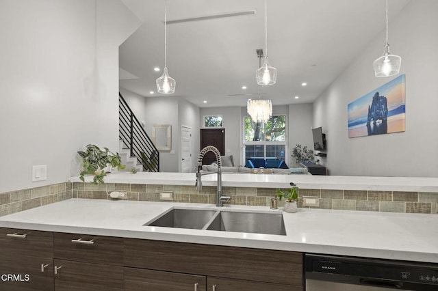 3236 Royal Oaks Dr Unit 5, Thousand Oaks, CA 91362 - kitchen featuring a sink, dishwasher, light countertops, open floor plan, and dark brown cabinetry