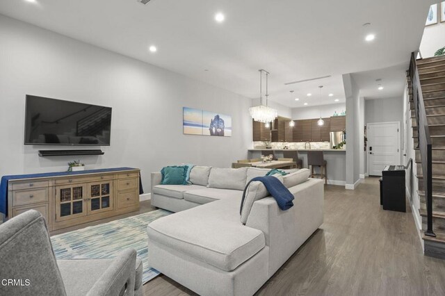 3236 Royal Oaks Dr Unit 5, Thousand Oaks, CA 91362 - living area with wood finished floors, stairway, and recessed lighting