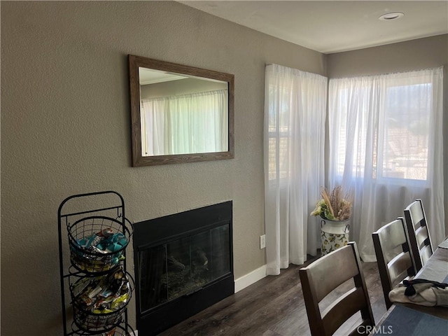 25886 Faircrest Cir, Hemet, CA 92544 - office space with dark wood-style floors, baseboards, a textured wall, and a glass covered fireplace