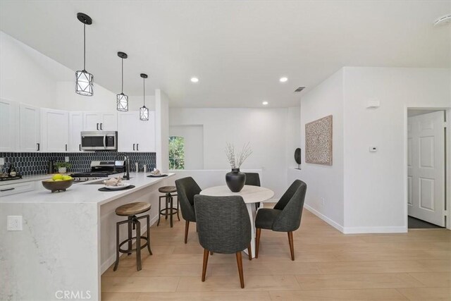7 Montara Dr, Aliso Viejo, CA 92656 - dining area with light wood finished floors and recessed lighting