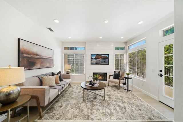 7 Montara Dr, Aliso Viejo, CA 92656 - living room featuring a large fireplace, recessed lighting, and light wood-style floors
