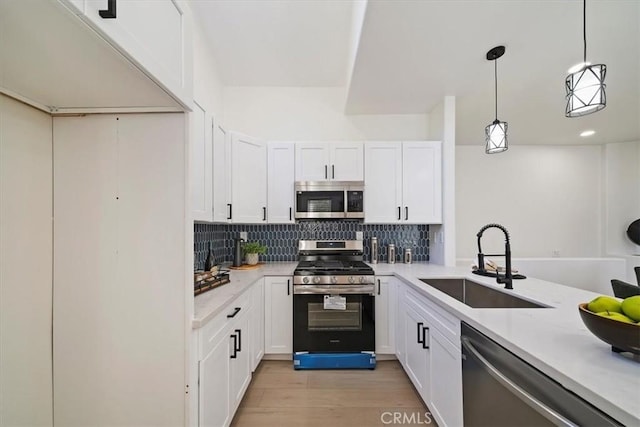 7 Montara Dr, Aliso Viejo, CA 92656 - kitchen featuring stainless steel appliances, light countertops, backsplash, and white cabinets