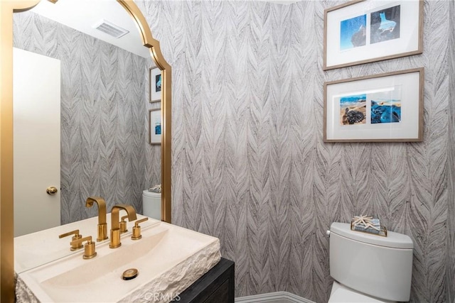 3667 Hawks Dr, Brea, CA 92823 - bathroom featuring toilet, vanity, and wallpapered walls