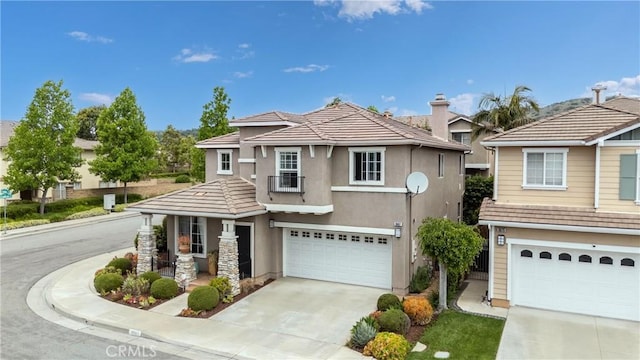 3667 Hawks Dr, Brea, CA 92823 - view of front facade featuring a garage, driveway, stucco siding, and a tile roof