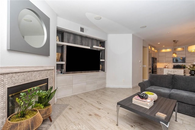 3667 Hawks Dr, Brea, CA 92823 - living area featuring wood finished floors, a tile fireplace, baseboards, and recessed lighting