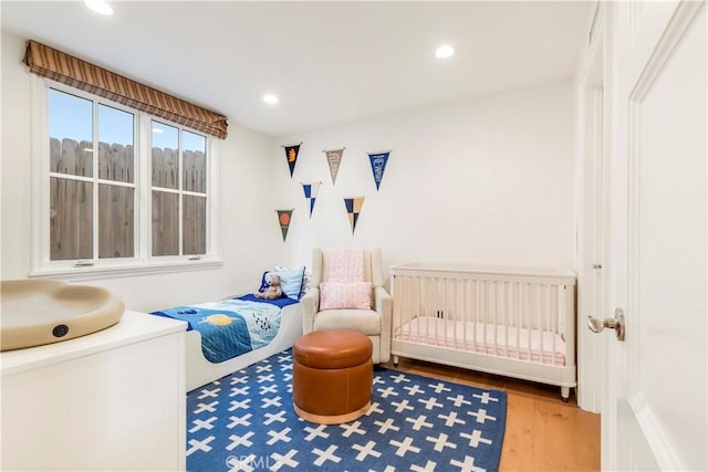 7161/2 Iris Ave, Corona Del Mar, CA 92625 - bedroom featuring radiator heating unit, wood finished floors, and recessed lighting