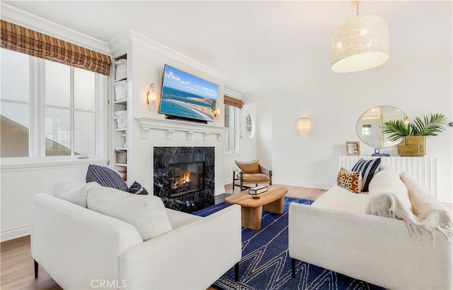 7161/2 Iris Ave, Corona Del Mar, CA 92625 - living area with dark wood-type flooring, baseboards, a high end fireplace, and crown molding