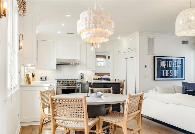 7161/2 Iris Ave, Corona Del Mar, CA 92625 - dining room featuring light wood-type flooring, recessed lighting, and ornamental molding