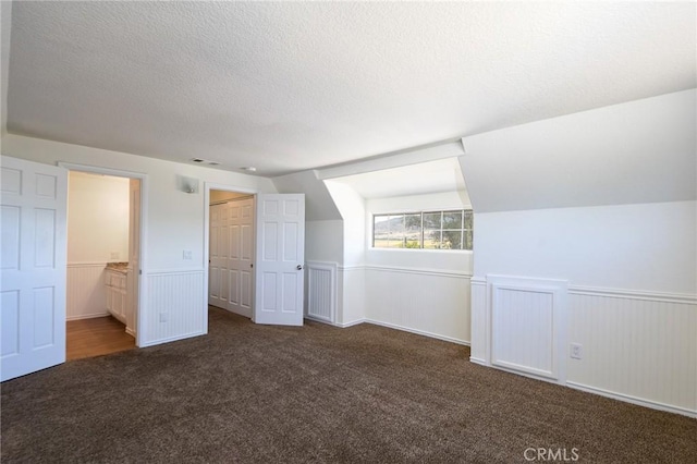 36055 Maddalena Rd, Winchester, CA 92596 - additional living space featuring carpet floors, a textured ceiling, and wainscoting