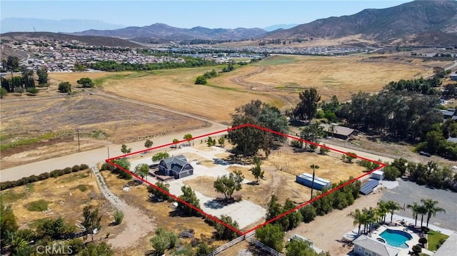 36055 Maddalena Rd, Winchester, CA 92596 - overview of rural landscape with property boundaries highlighted, a mountain backdrop, and a pool area