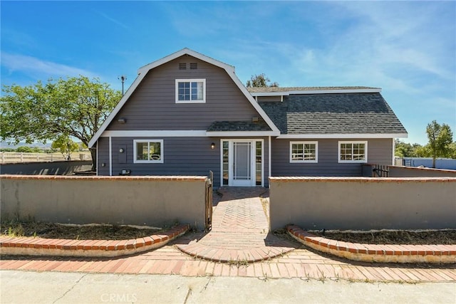 36055 Maddalena Rd, Winchester, CA 92596 - view of front of house with a fenced front yard, roof with shingles, and a gambrel roof