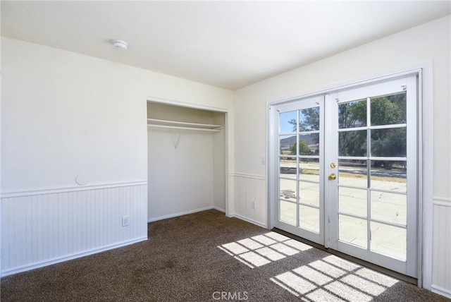 36055 Maddalena Rd, Winchester, CA 92596 - unfurnished bedroom featuring access to outside, wainscoting, french doors, carpet flooring, and a closet