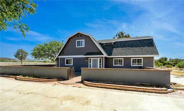 36055 Maddalena Rd, Winchester, CA 92596 - view of front of property with a fenced front yard, roof with shingles, and a gambrel roof