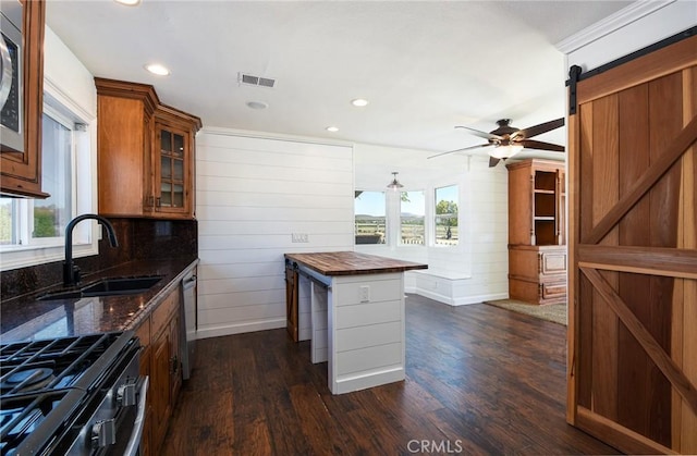 36055 Maddalena Rd, Winchester, CA 92596 - kitchen featuring a sink, appliances with stainless steel finishes, a ceiling fan, dark wood-style floors, and glass insert cabinets