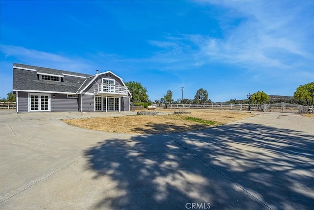 36055 Maddalena Rd, Winchester, CA 92596 - view of front of house with a gambrel roof and roof with shingles