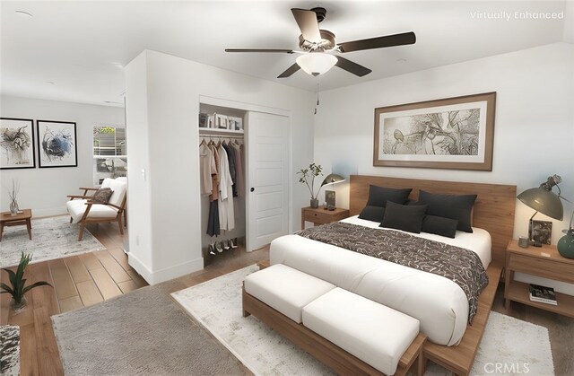 522 Sansoni St, Los Banos, CA 93635 - bedroom with a closet, wood finished floors, baseboards, and a ceiling fan