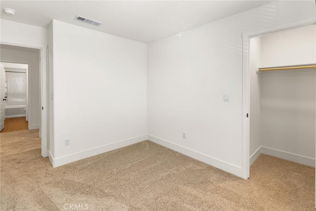 522 Sansoni St, Los Banos, CA 93635 - unfurnished bedroom with light carpet, a closet, and baseboards