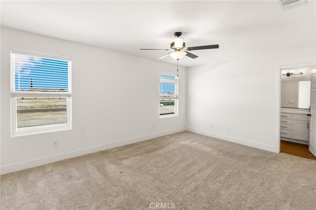 522 Sansoni St, Los Banos, CA 93635 - unfurnished bedroom featuring carpet floors, baseboards, and ensuite bathroom