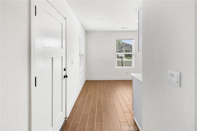 522 Sansoni St, Los Banos, CA 93635 - hall featuring wood finished floors and baseboards