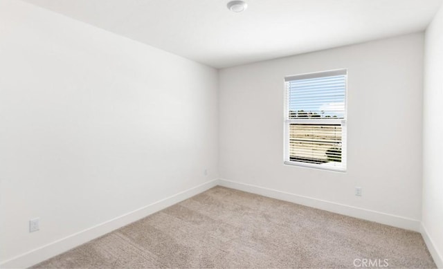 522 Sansoni St, Los Banos, CA 93635 - empty room with baseboards and light carpet