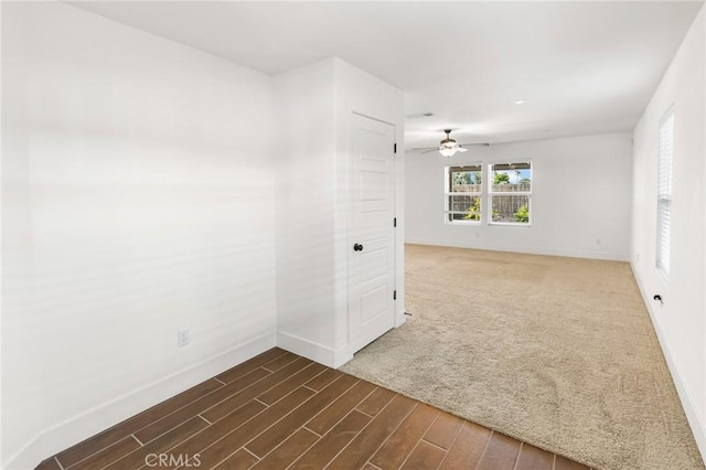 522 Sansoni St, Los Banos, CA 93635 - empty room featuring baseboards, a ceiling fan, and dark wood-style floors