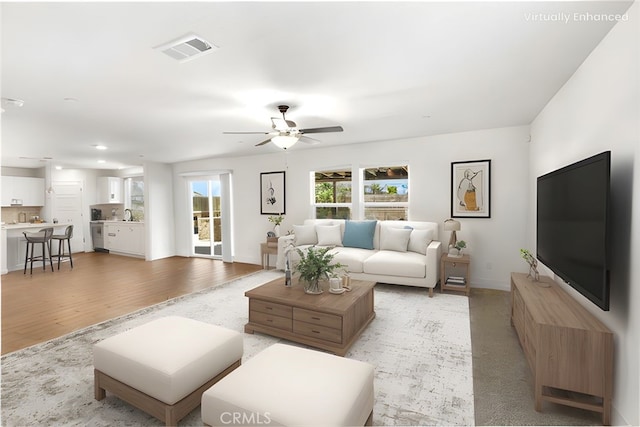 522 Sansoni St, Los Banos, CA 93635 - living area featuring light wood-type flooring, a ceiling fan, baseboards, and recessed lighting