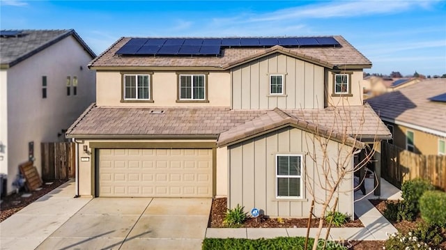 522 Sansoni St, Los Banos, CA 93635 - traditional home featuring board and batten siding, a garage, driveway, and solar panels