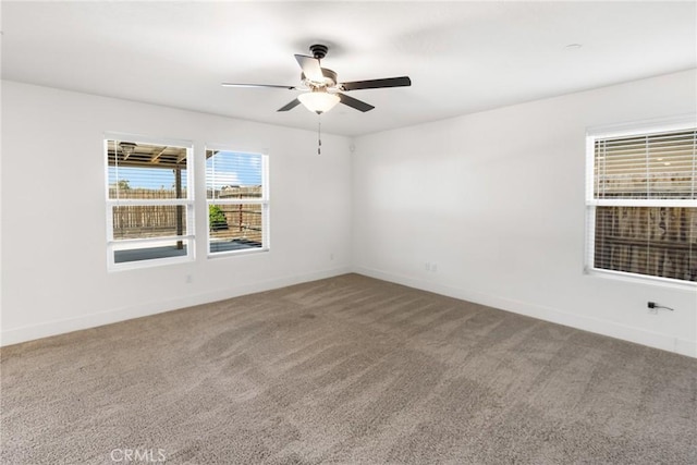 522 Sansoni St, Los Banos, CA 93635 - carpeted empty room with a ceiling fan and baseboards
