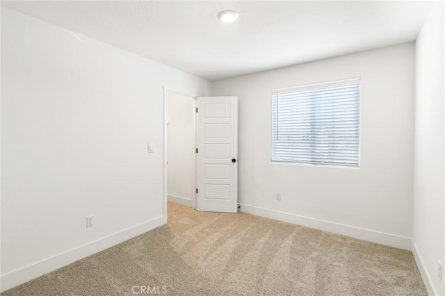 522 Sansoni St, Los Banos, CA 93635 - carpeted spare room featuring baseboards