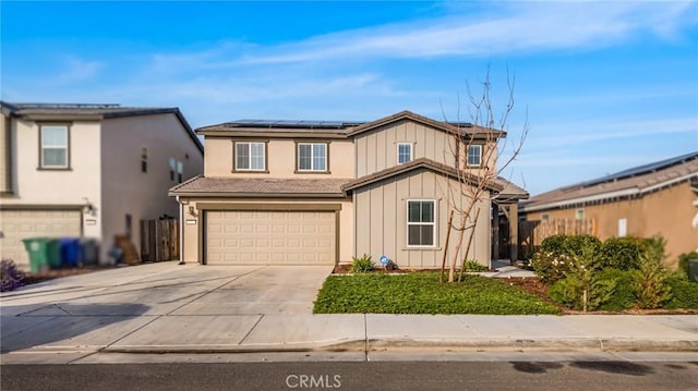 522 Sansoni St, Los Banos, CA 93635 - traditional home featuring board and batten siding, solar panels, driveway, and a garage