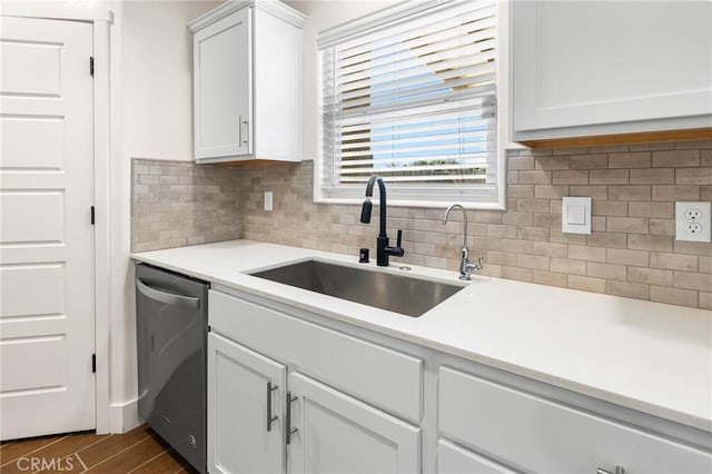 522 Sansoni St, Los Banos, CA 93635 - kitchen featuring dishwasher, a sink, decorative backsplash, white cabinets, and light countertops