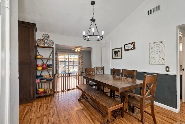 1807 Calle Sinaloa, Vista, CA 92084 - dining room featuring a chandelier, light wood-type flooring, vaulted ceiling, and ceiling fan