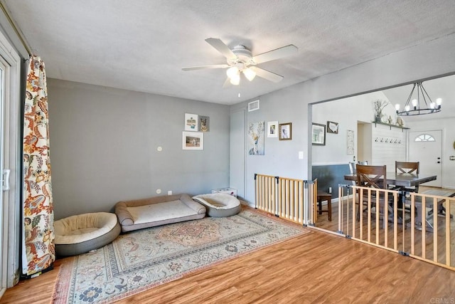 1807 Calle Sinaloa, Vista, CA 92084 - sitting room featuring wood finished floors, a chandelier, and a ceiling fan