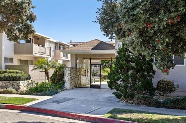3110 Merrill Dr Unit 67, Torrance, CA 90503 - view of front of house with a gate and stucco siding