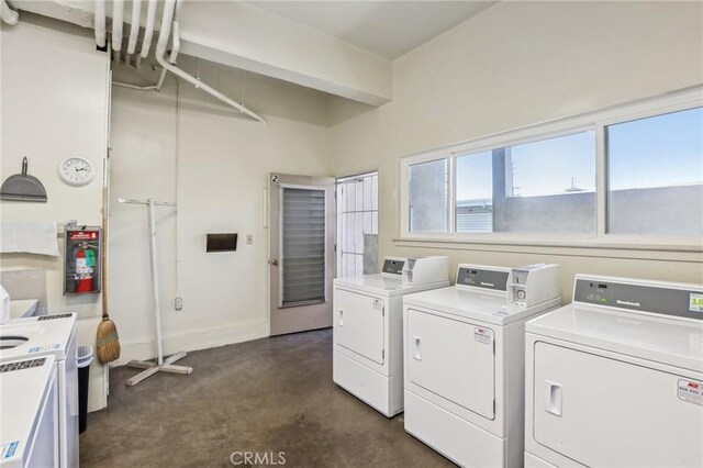 3110 Merrill Dr Unit 67, Torrance, CA 90503 - laundry room featuring washing machine and clothes dryer and baseboards