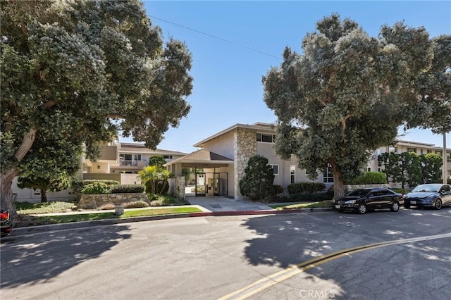 3110 Merrill Dr Unit 67, Torrance, CA 90503 - view of property hidden behind natural elements with stone siding and stucco siding