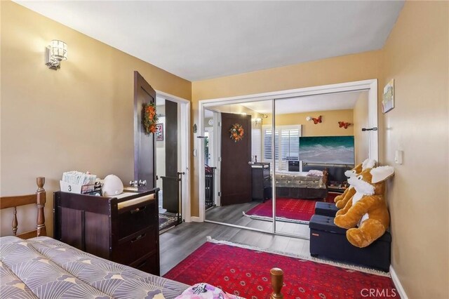 3110 Merrill Dr Unit 67, Torrance, CA 90503 - bedroom with wood finished floors, baseboards, and a closet