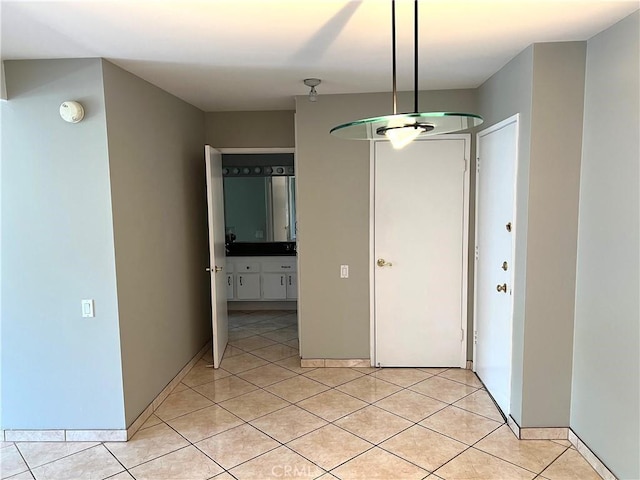 5460 White Oak Ave Unit G210, Encino, CA 91316 - unfurnished dining area with light tile patterned flooring and baseboards