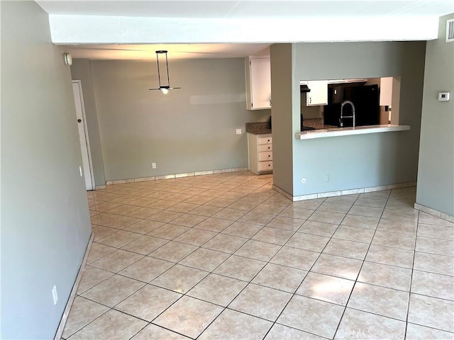 5460 White Oak Ave Unit G210, Encino, CA 91316 - unfurnished living room featuring light tile patterned floors and baseboards