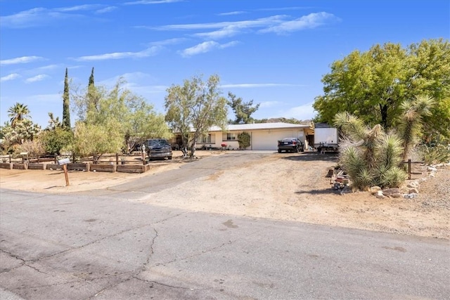 56455 Carlyle Dr, Yucca Valley, CA 92284 - view of front of home featuring a garage