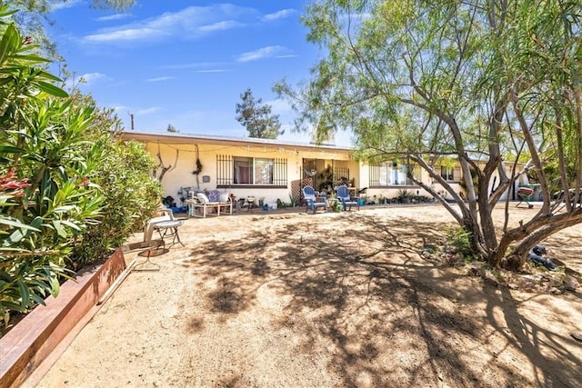 56455 Carlyle Dr, Yucca Valley, CA 92284 - rear view of house featuring stucco siding