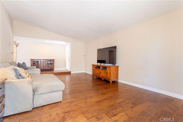 2065 Medina Ave, Simi Valley, CA 93063 - living room with wood finished floors, baseboards, and lofted ceiling