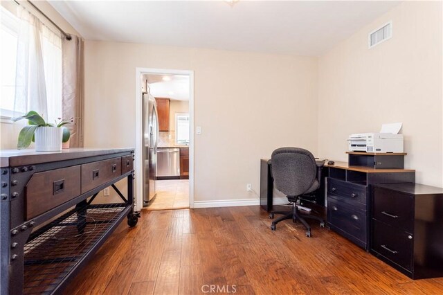 2065 Medina Ave, Simi Valley, CA 93063 - office area with hardwood / wood-style floors, healthy amount of natural light, and baseboards