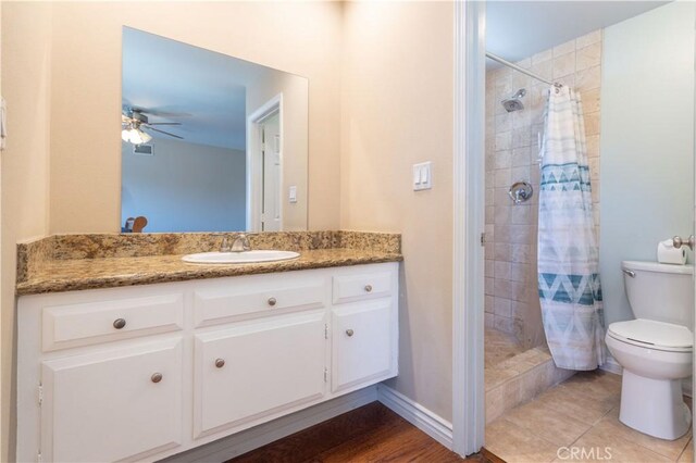 2065 Medina Ave, Simi Valley, CA 93063 - full bath featuring toilet, vanity, tiled shower, and ceiling fan