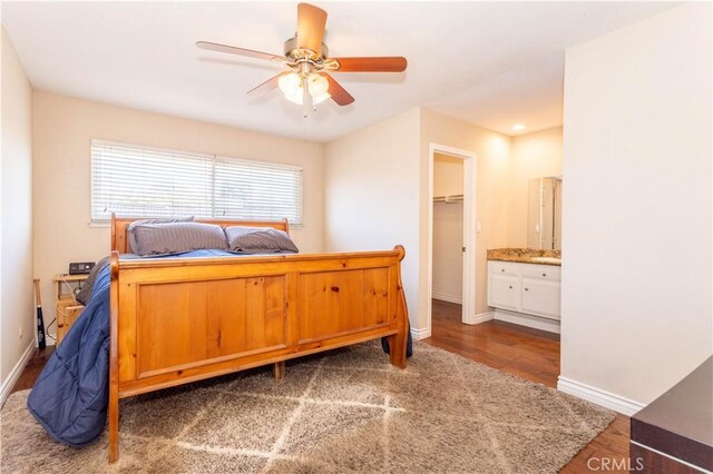 2065 Medina Ave, Simi Valley, CA 93063 - bedroom featuring wood finished floors, baseboards, and a spacious closet
