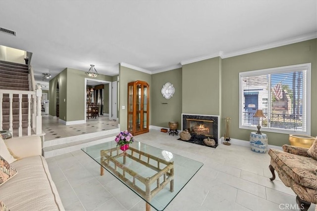 377 Roycroft Ave, Long Beach, CA 90814 - living area featuring a lit fireplace, stairway, tile patterned flooring, crown molding, and baseboards