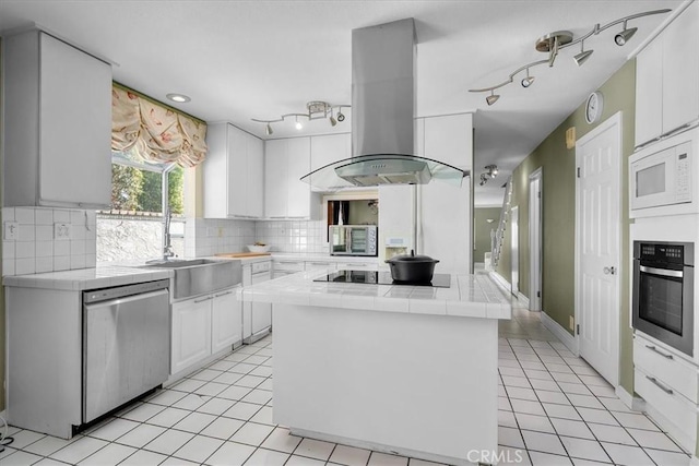 377 Roycroft Ave, Long Beach, CA 90814 - kitchen with stainless steel appliances, island exhaust hood, tile countertops, a sink, and light tile patterned floors
